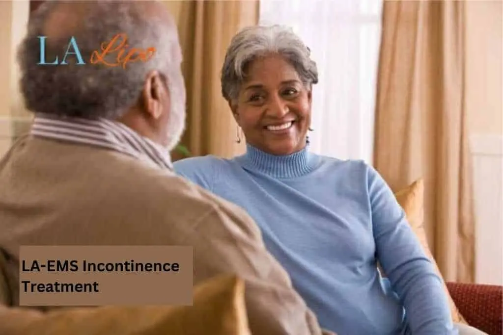 Couple sat smiling at each other - LA-EMS treatment Bushey