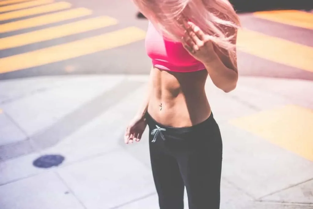 Woman with toned stomach after LA-EMS Body Sculpting Treatment Bushey 