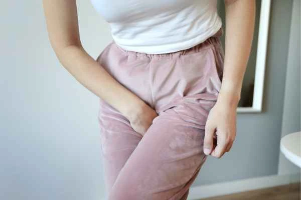 woman running for the toilet because of urinary incontinence Bushey